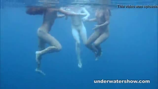 Young lesbos getting nude in swimming pool